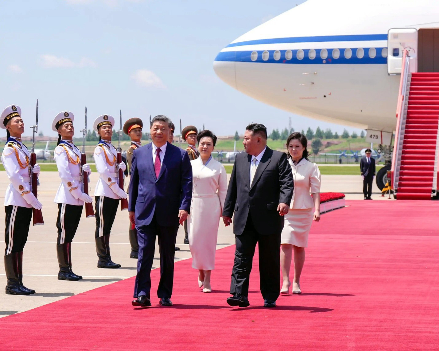Kim Jong-Un and an honor guard greet Xi Jinping upon his arrival in North Korea in June 2026